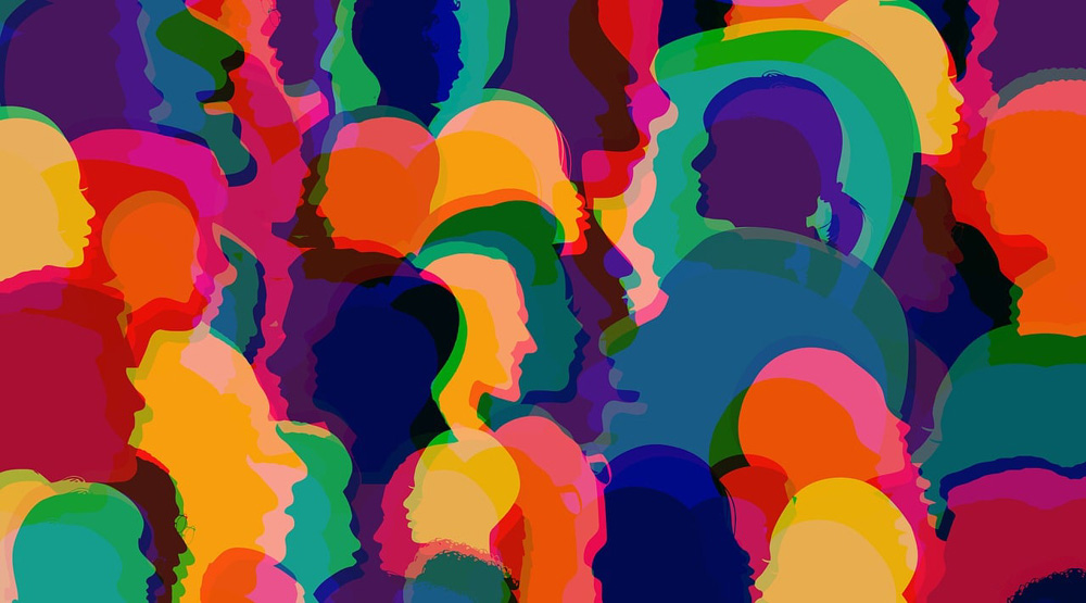 Desenho de inúmeras silhuetas coloridas representativas da diversidade populacional. Desenho de inúmeras silhuetas coloridas representativas da diversidade populacional.