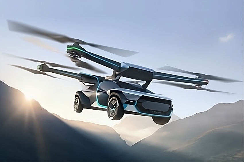 Foto promocional do XPeng AeroHT X3, um carro voador, em design arrojado nas cores preto, azul e cinza, sobrevoando montanhas ao amanhecer, com o sol nascendo ao fundo. Foto promocional do XPeng AeroHT X3, um carro voador, em design arrojado nas cores preto, azul e cinza, sobrevoando montanhas ao amanhecer, com o sol nascendo ao fundo.